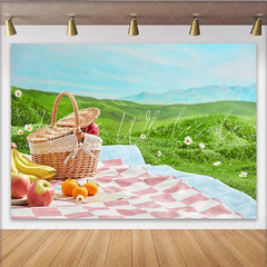 Lofaris Charming Picnic Photography Backdrop with Wicker Basket and Fruits Lush Green Hills Studio Outdoor Photoshoot