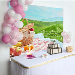Lofaris Charming Picnic Photography Backdrop with Wicker Basket and Fruits Lush Green Hills Studio Outdoor Photoshoot